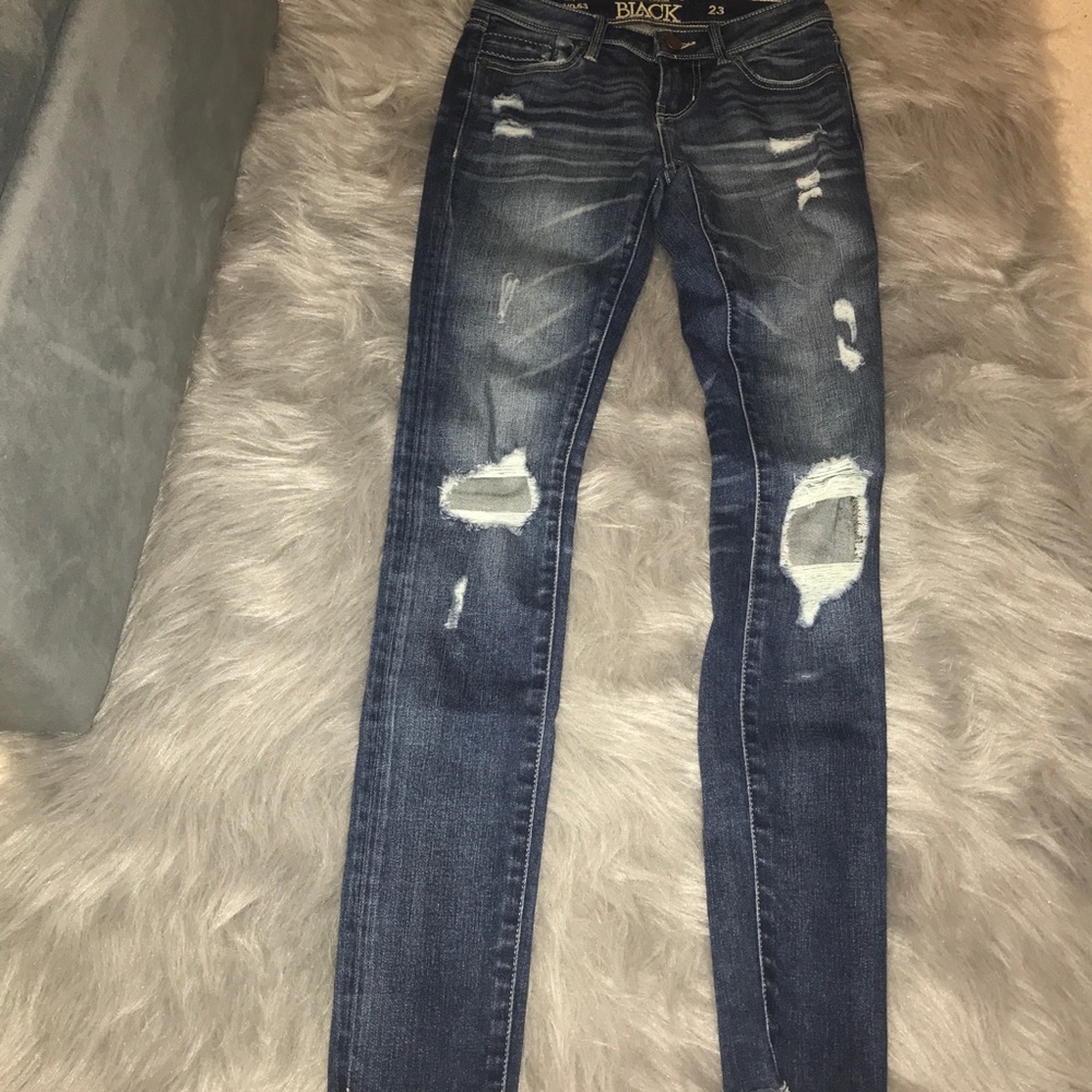 Buckle black ripped jeans